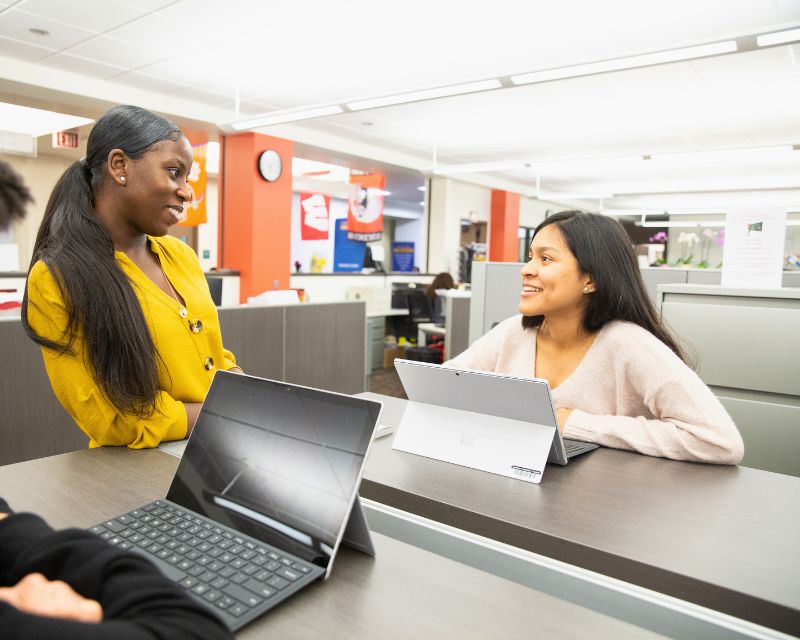 Counselor interacting with a GCC student