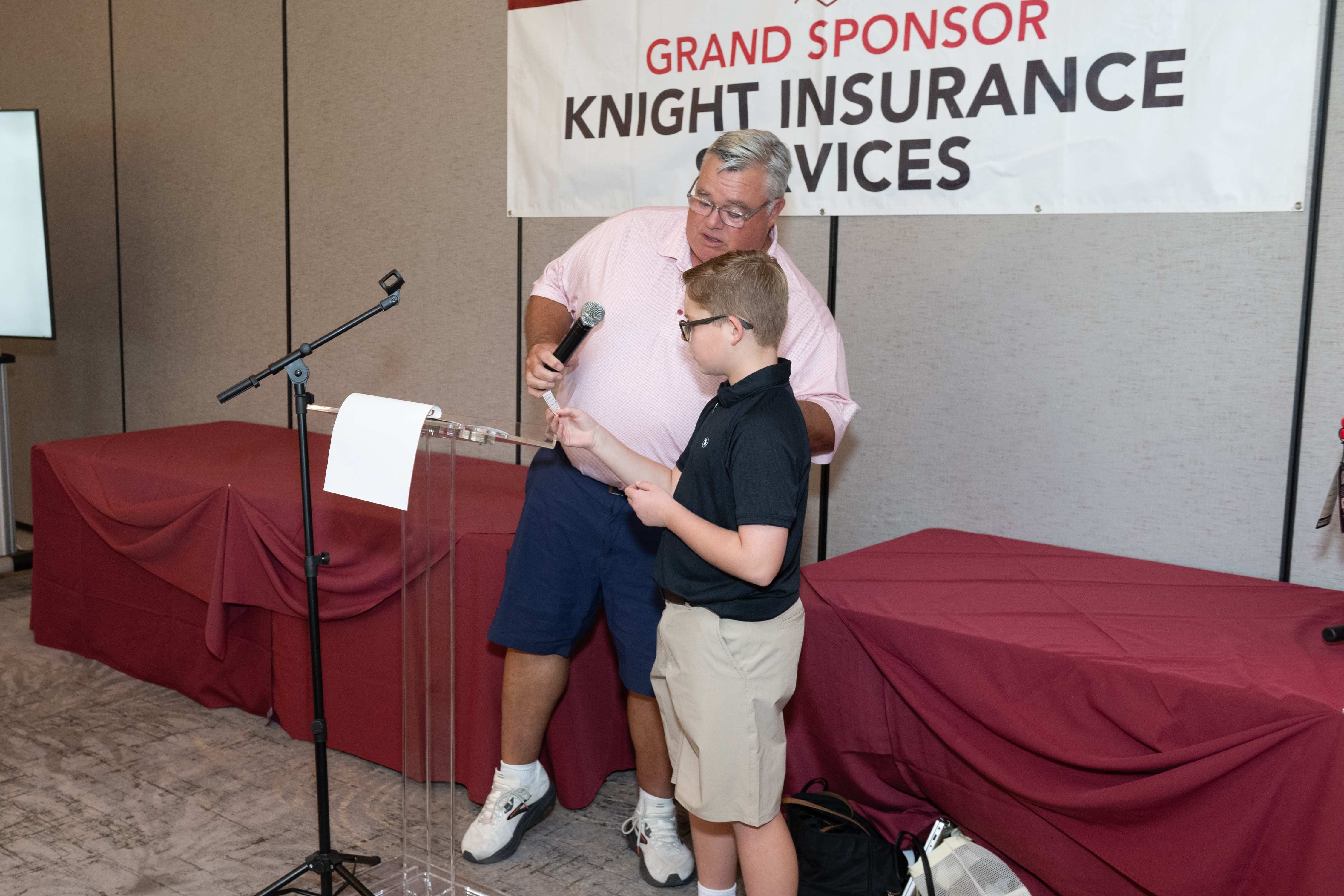 Rick Dinger and Parker Cornner draw the 2026 Golf Raffle prize winner Nick Howell from USC Verdugo Hills Hospital. 