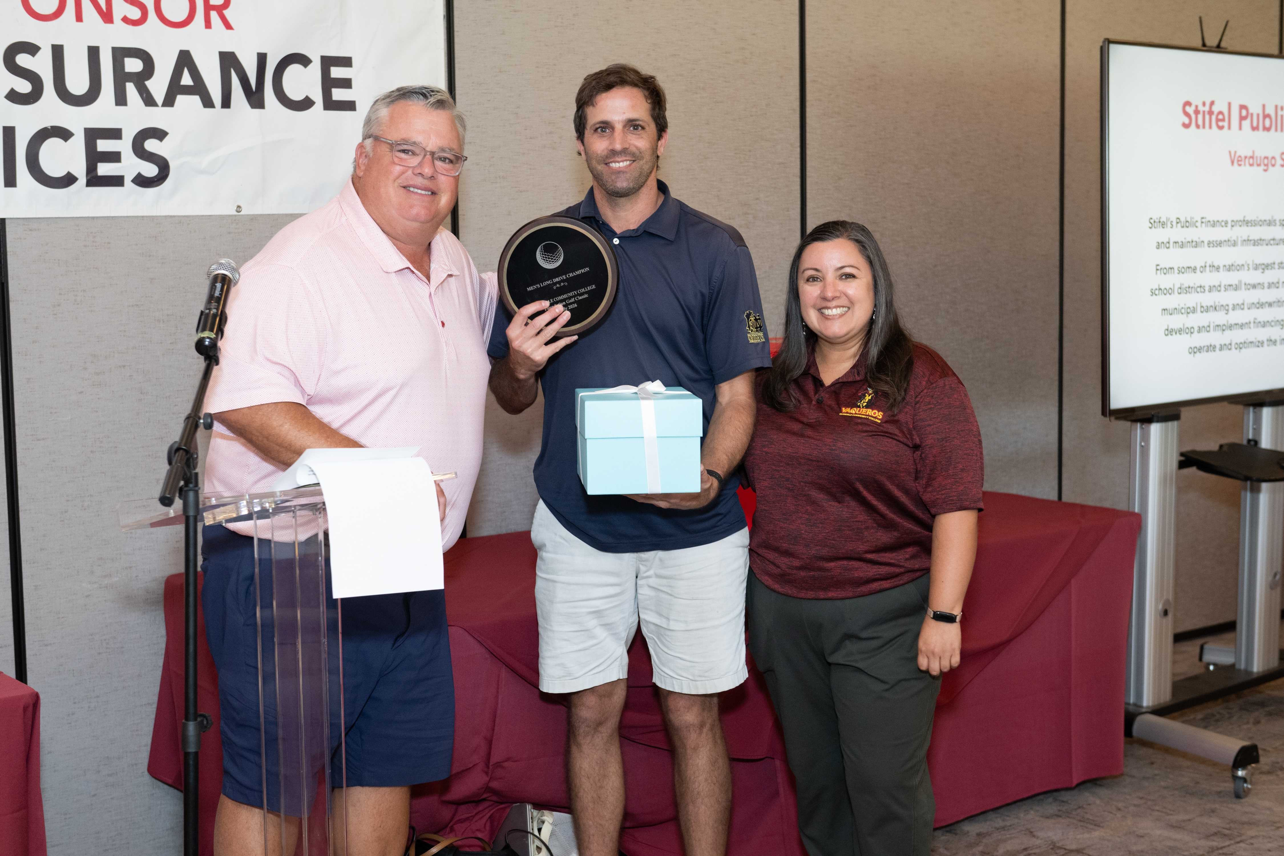 Rick Dinger and Paola Santana presents Men's Long Drive to Greg Moss. 