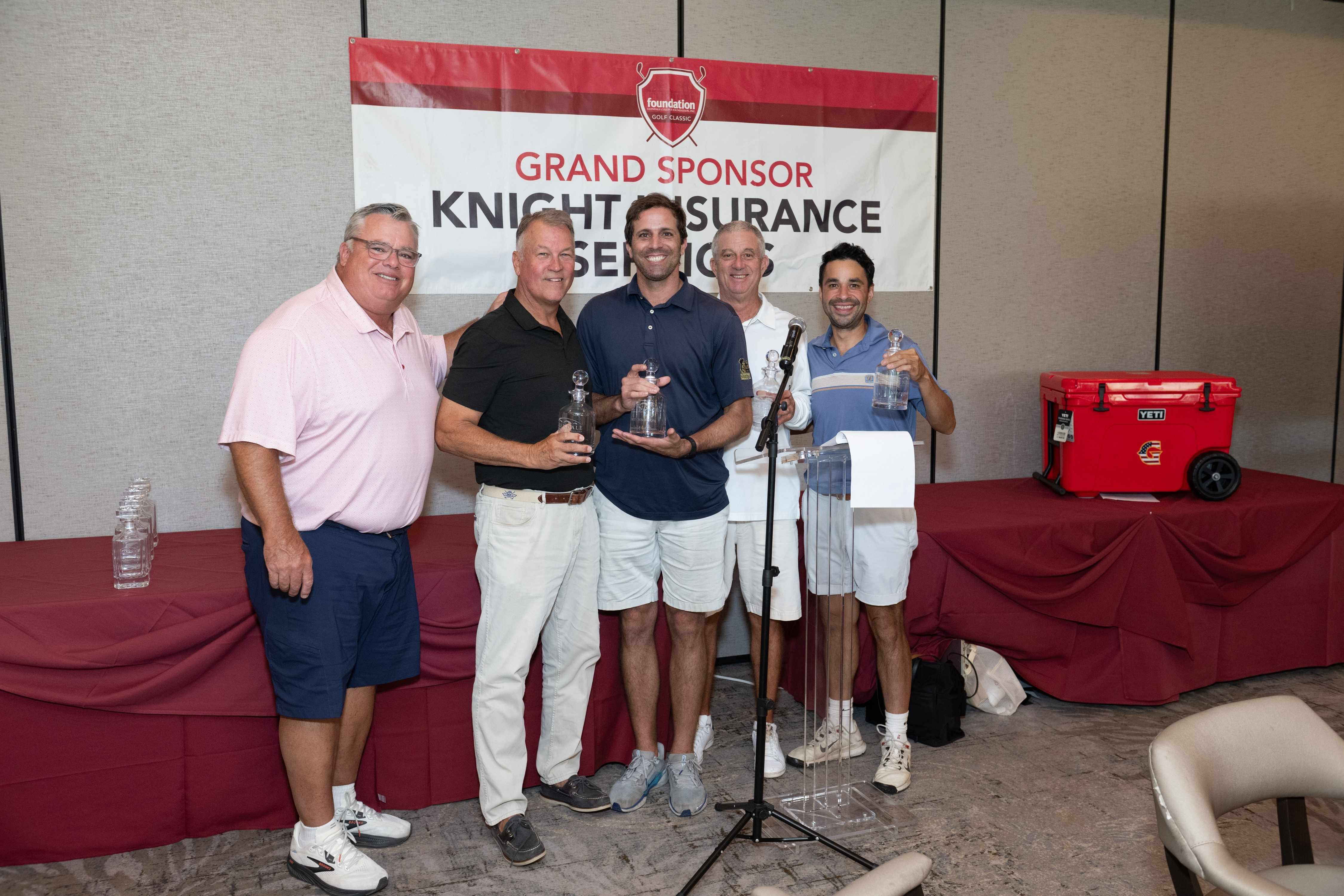 Rick Dinger presents the Truemark Real Estate Management Team with 1st Place Net.